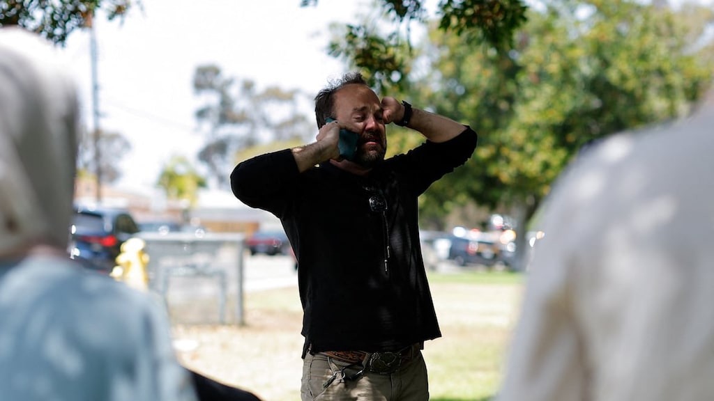 A person speaks on a mobile phone near the Islamic Center of San Diego following a reported shooting incident on Monday. 