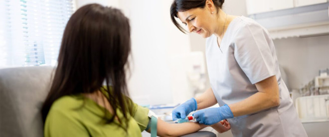 Nurse collecting blood for a cholesterol test